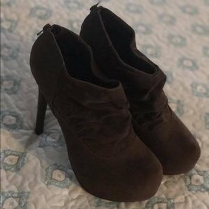 Closed toe brown heels.